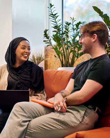 Two employees talking in GSK House